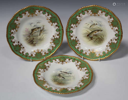 A set of three Coalport porcelain ichthyology plates, circa 1910, painted by P. Simpson, signed,