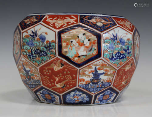A Japanese Imari porcelain jardinière, Meiji period, of faceted circular form, painted with panels