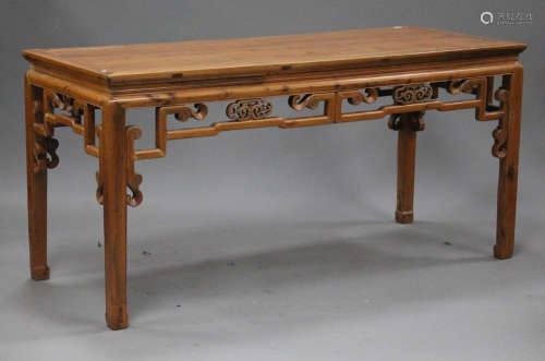 A Chinese softwood altar table, 20th century, the rectangular panelled top above a carved and