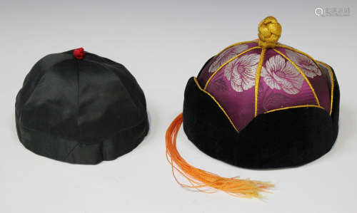 A Chinese silk hat, 20th century, the purple silk decorated with white and gilt flowers within