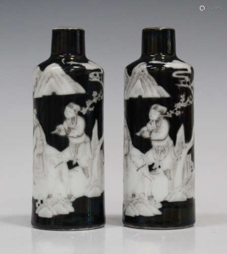A pair of Chinese black ground porcelain cylindrical snuff bottles, early 20th century, each