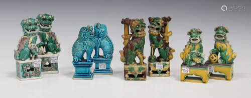 A pair of Chinese sancai glazed porcelain Buddhistic lion jostick holders, late 19th century, each