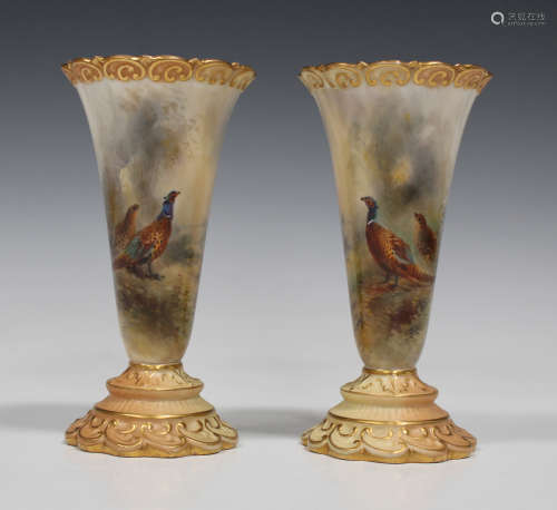 A pair of Royal Worcester porcelain trumpet vases, circa 1914, painted by Jas. Stinton, signed, with