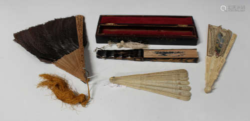 A Chinese Canton export lacquer folding fan, late 19th century, the guards and eighteen sticks