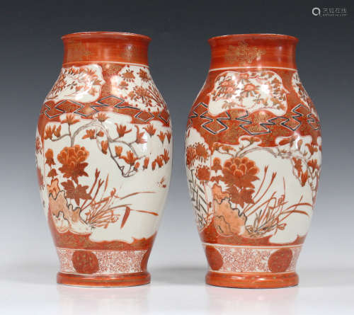 A pair of Japanese Kutani porcelain vases, Meiji period, painted with flowers, height 33cm.Buyer’s