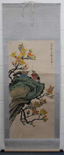A Chinese hanging scroll painting, modern, depicting two birds, rocks and blossoming branches, 128cm