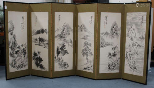 A Japanese six-fold screen, late 19th/early 20th century, each panel inset with a monochrome