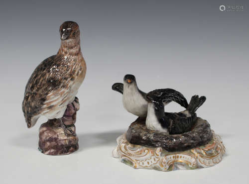 A Berlin porcelain model of a quail, second half 19th century, standing on a rocky base,
