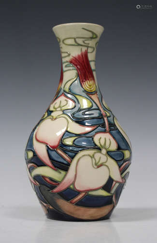 A Moorcroft pottery vase, circa 2007, the baluster body decorated with lilies against a cream to