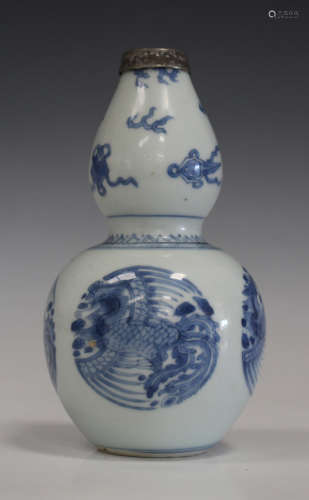 A Chinese blue and white porcelain double gourd vase, mark of Xuande but Kangxi period, the lower