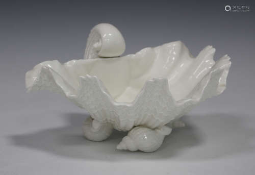 A Royal Worcester porcelain white glazed shell shaped dish, circa 1960, raised on three shell