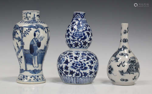 A Chinese blue and white double gourd shaped vase, mark of Kangxi but late 19th century, painted