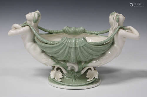 A Minton porcelain celadon and cream glazed shell centrepiece, circa 1869, supported at each end