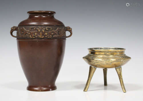 A Chinese polished bronze tripod censer, mark of Xuande but 20th century, engraved with dragons,
