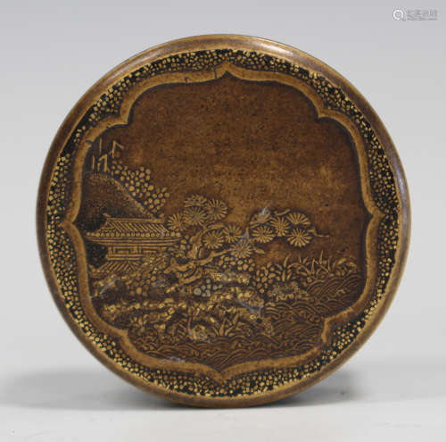 A Japanese gilt lacquer small circular box and cover, Meiji period, the top decorated with