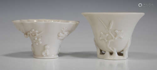 Two Chinese blanc-de-Chine porcelain libation cups, probably Kangxi period, of horn outline, one