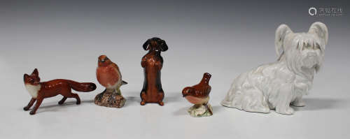 Four Beswick models of animals, comprising Fox standing, No. 1440, Dachshund begging, No. 1461,
