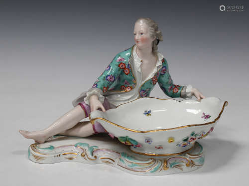 A Meissen porcelain figural sweetmeat dish, late 19th century, outside factory decorated, modelled
