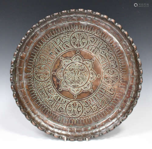 A Turkish Ottoman copper circular tray, probably 19th century, with engraved figural panel within