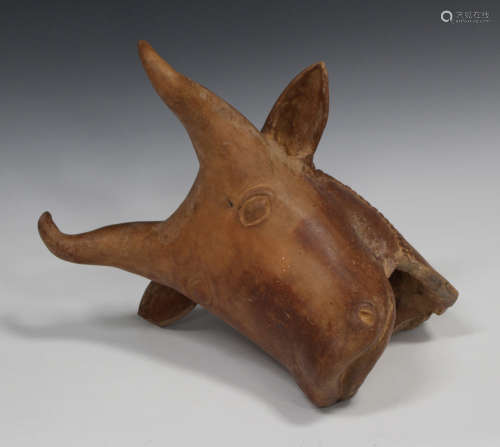 An Amlash style pottery bull's head, length 36cm.Buyer’s Premium 29.4% (including VAT @ 20%) of