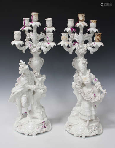 A pair of white glazed French porcelain five light candelabra, Charenton, late 19th century,