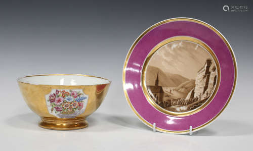 A Paris porcelain plate, circa 1830, painted in sepia colours with a landscape view of a