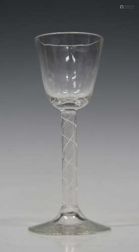 A double series opaque twist wine glass with rounded funnel bowl, the stem with a pair of spiral