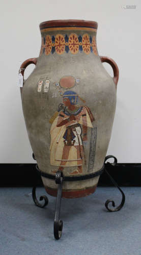 A large two handled pottery floor vase, early 20th century, of high shouldered form, painted with an