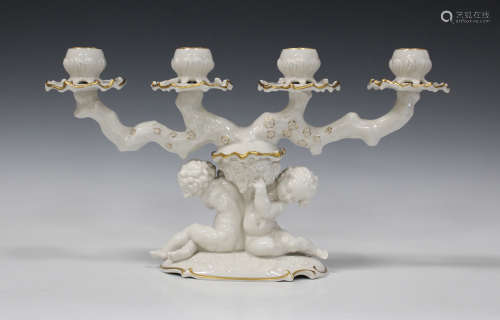 A Lorenz Hutschenreuther white glazed porcelain candelabrum, 20th century, modelled as a pair of