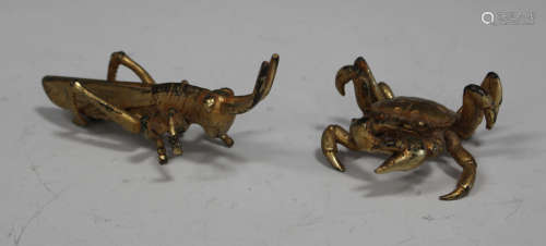 Two Chinese gilt metal figures of a crab and a grasshopper, lengths 5.5cm and 11cm.Buyer’s Premium