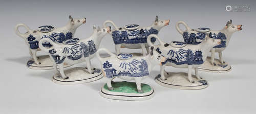 A Staffordshire pottery cow creamer and cover, mid/late 19th century, blue printed with a