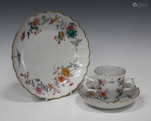 A Chinese famille rose export porcelain trembleuse cup and saucer and matching saucer dish, Qianlong