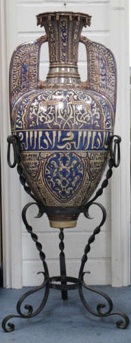A large Hispano-Moresque copper and blue lustre two handled vase, 19th century, the amphora shaped
