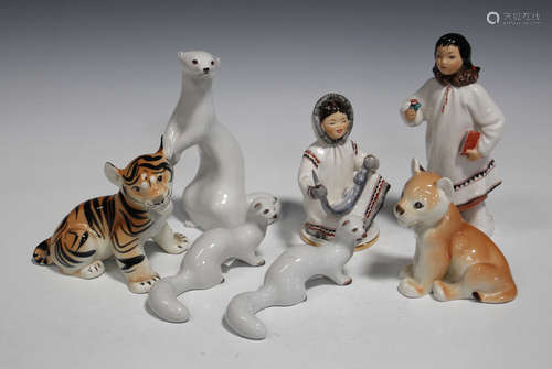 Four Russian Lomonosov porcelain figures, 1968-1990, comprising two eskimos, a stoat and a lion cub,