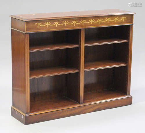 A late 20th century reproduction mahogany open bookcase, inlaid with foliate swags and crossbanded