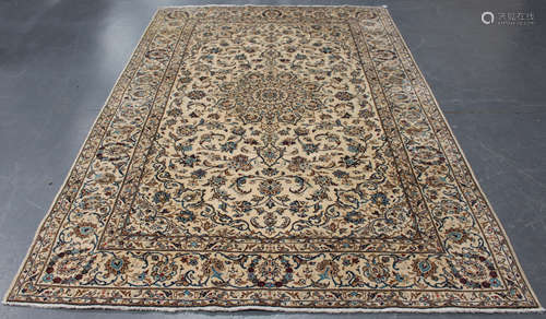 A Kashan carpet, Central Persia, mid/late 20th century, the ivory field with a flowerhead