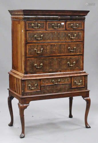 A William and Mary oyster veneered chest-on-stand with feather banded decoration, the moulded