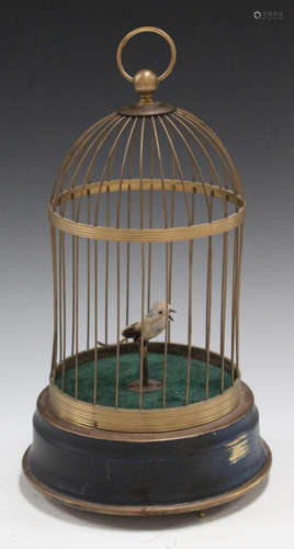 A late 20th century gilt brass singing bird automaton, mounted within a wirework cage, height 30cm.