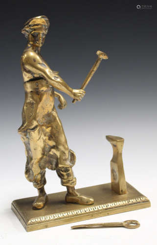 A 20th century brass model of a blacksmith working at an anvil, height 32cm.Buyer’s Premium 29.4% (
