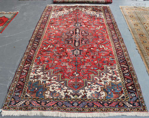 A Heriz kelleh, North-west Persia, mid-20th century, the red field with a flowerhead medallion,