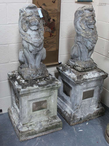 A pair of early/mid-20th century cast composition garden models of stylized seated lions, both