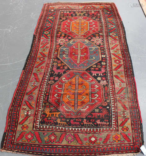 A Garabagh rug, South-east Caucasus, early 20th century, the charcoal field with three large