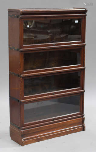 A group of three early 20th century oak Globe Wernicke glazed bookcases, comprising two four-section