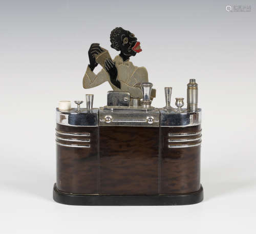 A Ronson touch-tip bar tender novelty table lighter in the form of a man behind a bar with