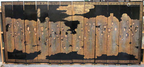 A large 20th century Chinese black lacquered twelve-fold screen, decorated with figures within a