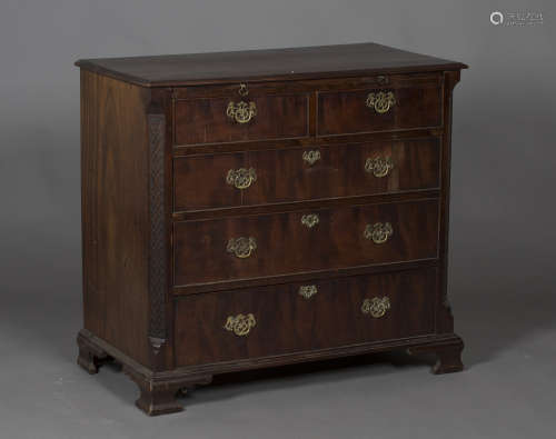 A George III mahogany chest of two short and three long graduated drawers, fitted with a brushing