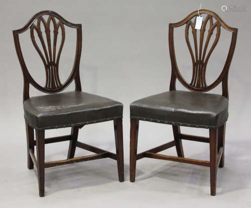 A set of six 19th century mahogany dining chairs with pierced splat backs, the seats overstuffed