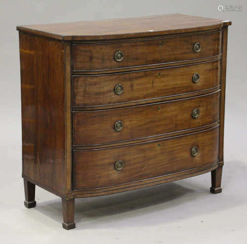 A George IV mahogany and ebony line inlaid break bowfront chest of four graduated long drawers