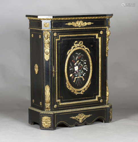 A late 19th century French ebonized and gilt metal mounted side cabinet, the door with an oval