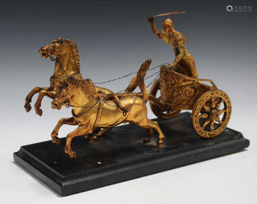 A 19th century Continental gilded cast bronze equestrian figure group of a Roman soldier riding a